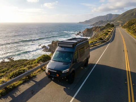 best places to snorkel - Camper van parked on a coastal highway above the Pacific at sunset