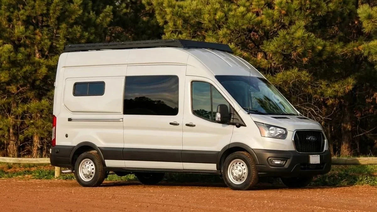 camper van cost of ownership - The single most prominent feature in this photo is the exterior of a white Ford