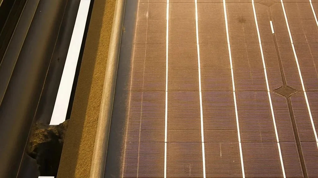 camper van solar - The most prominent feature in the photo is the solar panel mounted on the camper