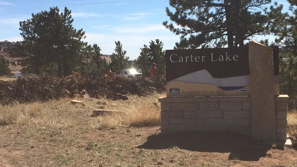 Carter Lake - The Carter Lake entrance sign with the reservoir and foothills behind it, Larimer County, Colorado