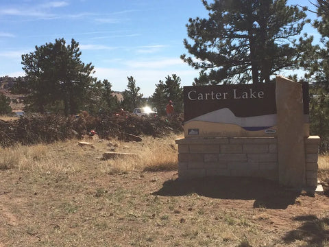 Carter Lake - The Carter Lake entrance sign with the reservoir and foothills behind it, Larimer County, Colorado