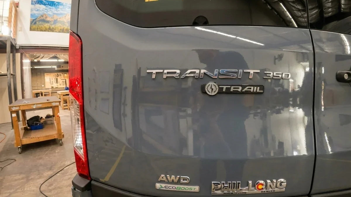 ford van models - The most prominent feature in the photo is the rear exterior of a Ford Transit 3