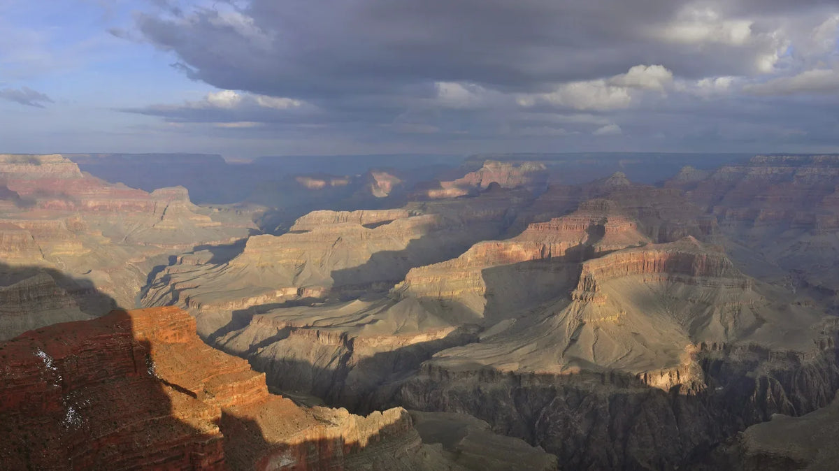 sunset spot - Grand Canyon seen from Hopi Point at sunset, with storm light over the rim