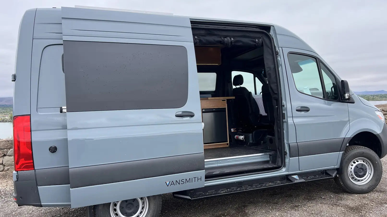 inside of a sprinter van - This image shows a light blue Mercedes-Benz Sprinter van converted by The Vansmi