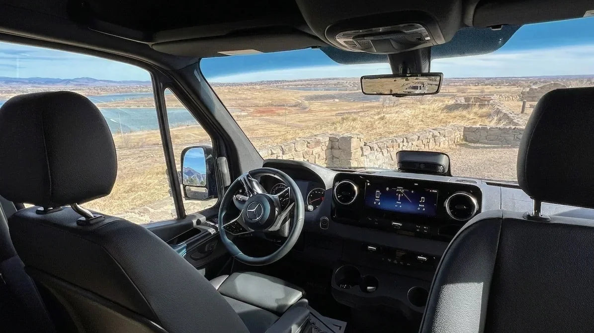mercedes sprinter interior - This photo shows the driver and passenger seats of a Mercedes-Benz Sprinter van,