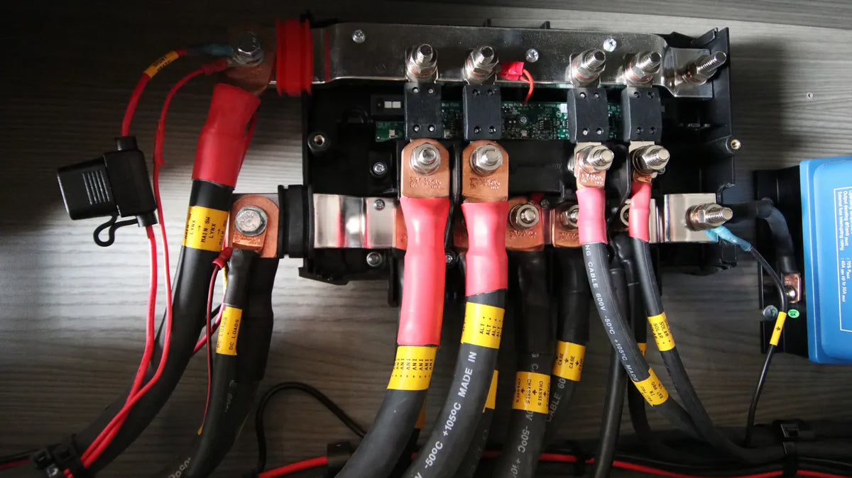 RV Battery Not Charging - Battery cables and fuses on a camper van busbar