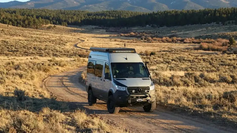 rv trader oregon - Off-road van driving on a dirt trail in wilderness