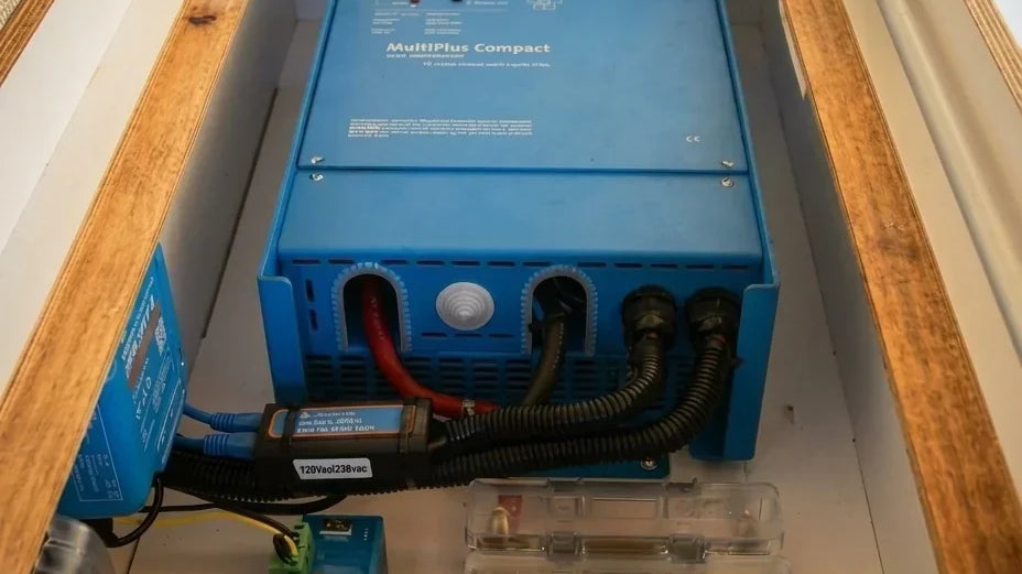 victron multiplus - This photo shows a close-up of a camper van's electrical system compartment