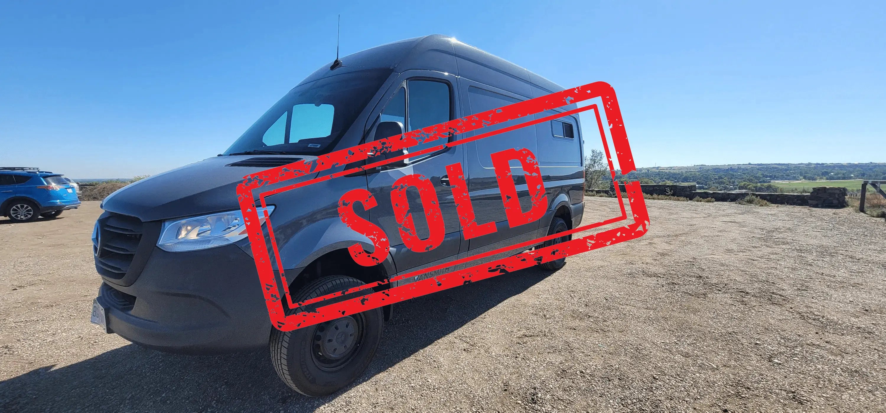 Exterior of Legacy DUO 4x4 Sprinter Van Conversion with "Sold" Stamp – The Vansmith
