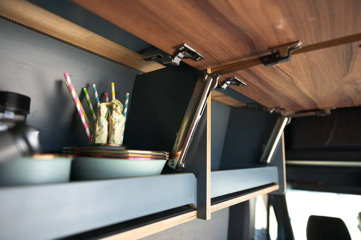 Items in Upper Wood Shelves of The Vansmith Duo XL Van Conversion for Couples