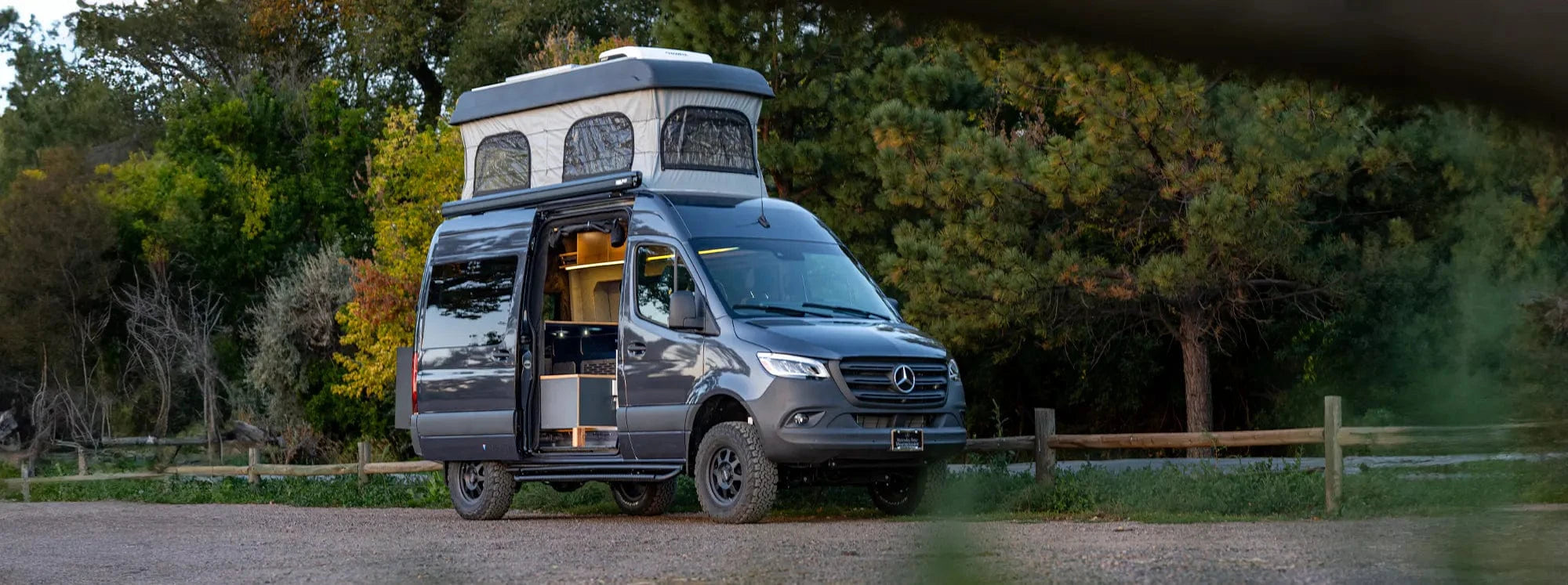 Sprinter Family Van Conversion by The Vansmith with Pop-Top and Side Door Open