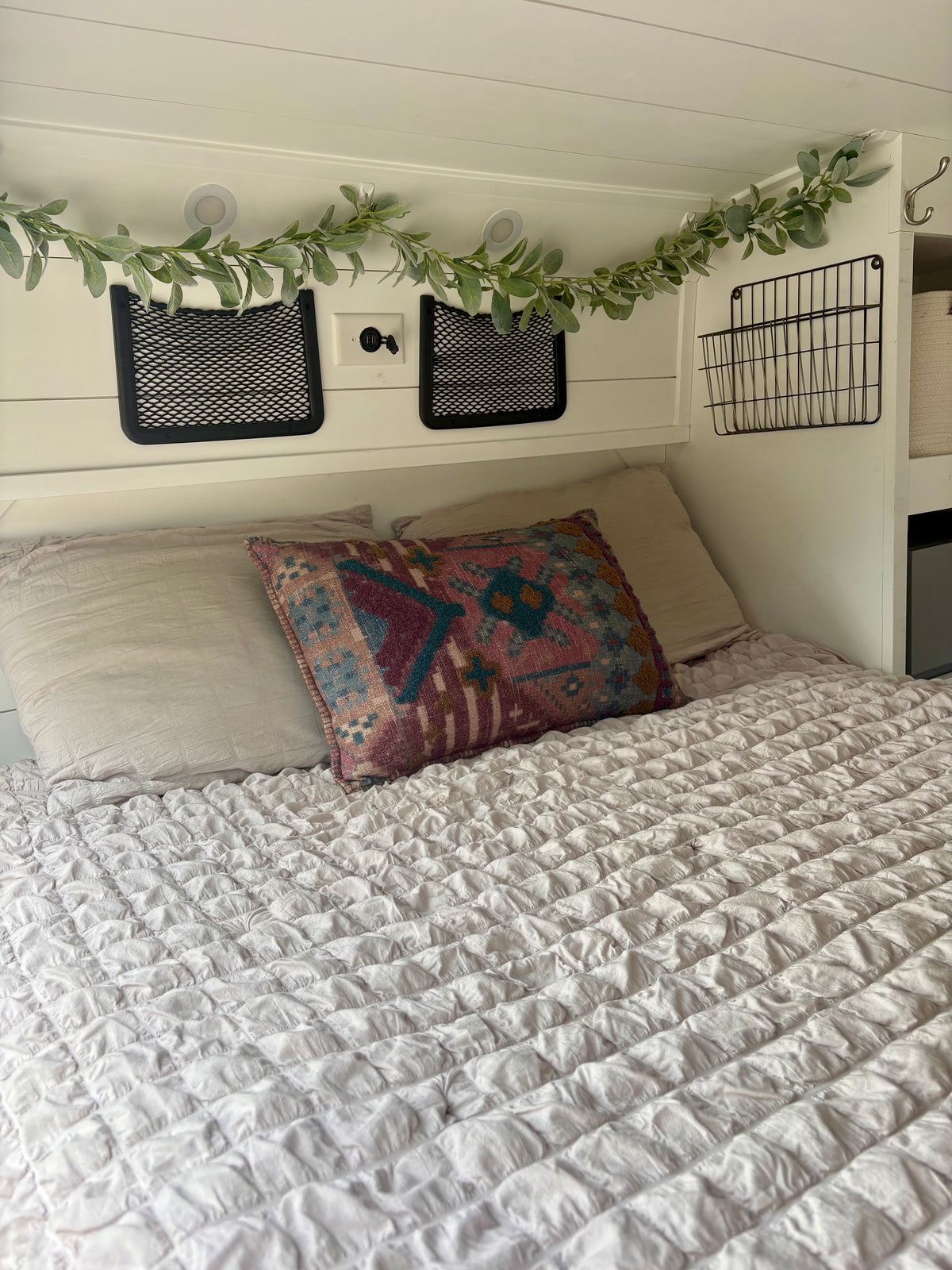 Fixed rear bed made up in the ProMaster camper conversion