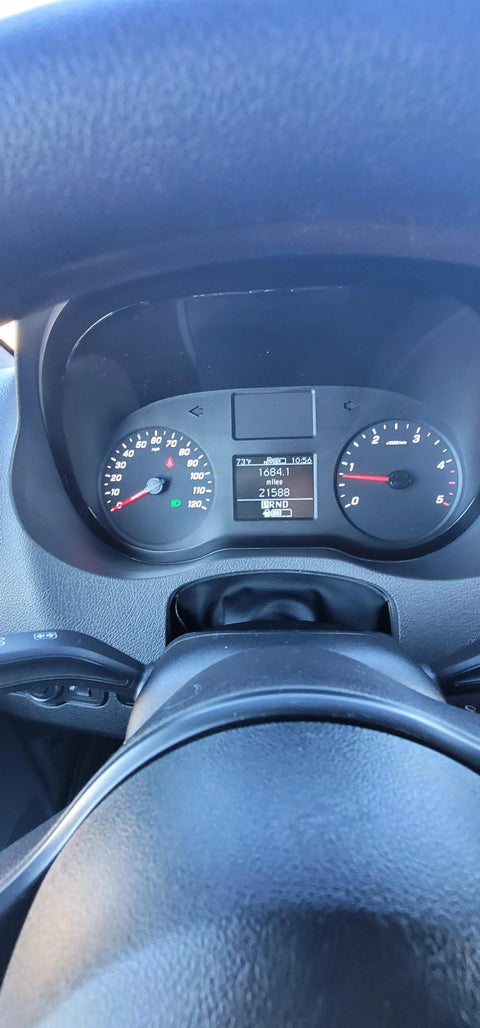 3k in miles - The most prominent feature in the photo is the vehicle's dashboard, which displa