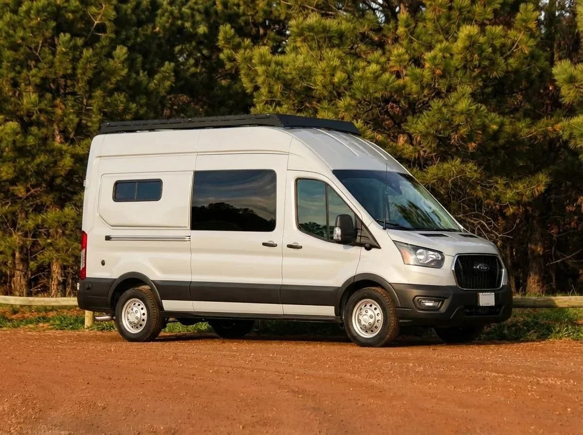 camper van cost of ownership - The single most prominent feature in this photo is the exterior of a white Ford 