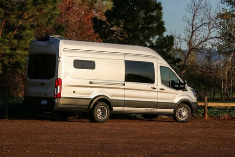 camper van financing rates - The exterior features a prominently positioned Ford Transit van with a sleek sil