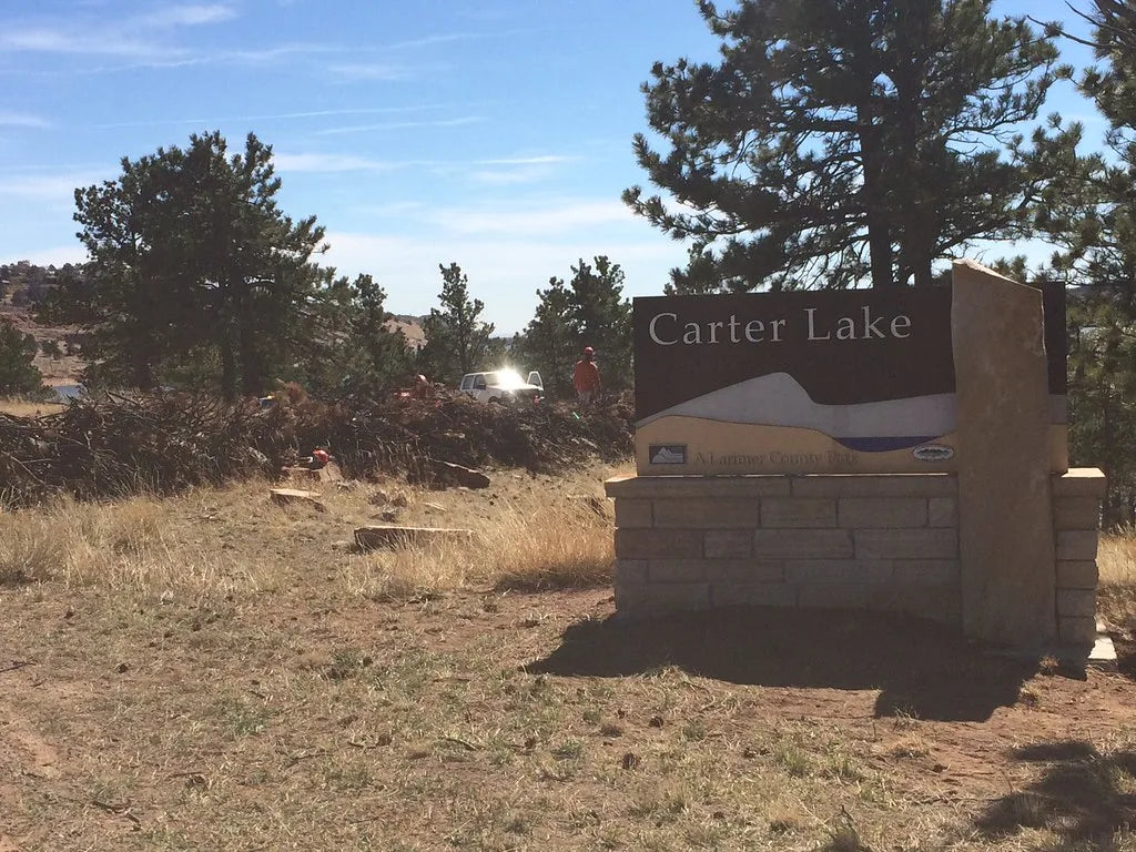 Carter Lake - The Carter Lake entrance sign with the reservoir and foothills behind it, Larimer County, Colorado