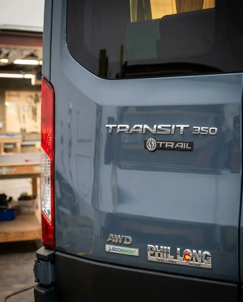 custom ford transit connect - The most prominent feature in this photo is the rear exterior of a Ford Transit 