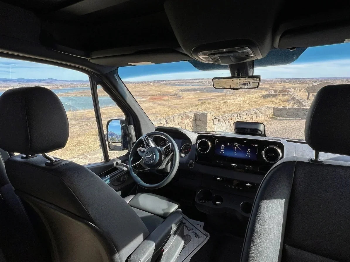 mercedes sprinter interior - This photo shows the driver and passenger seats of a Mercedes-Benz Sprinter van,