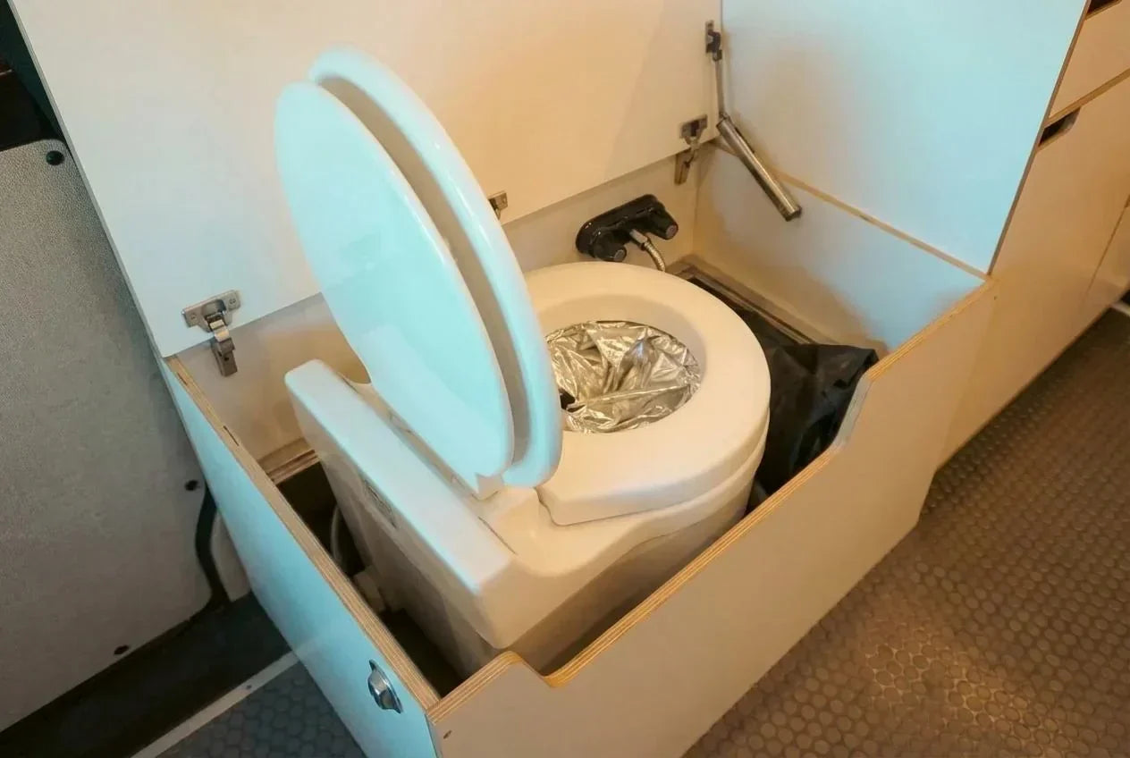 pop up camper with toilet - The most prominent feature in this photo is the compact toilet unit, designed fo