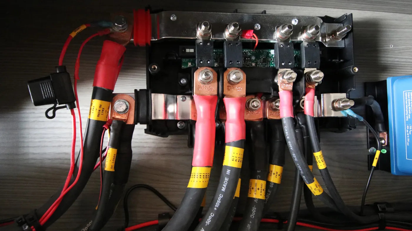 RV Battery Not Charging - Battery cables and fuses on a camper van busbar