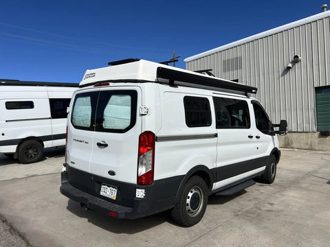van conversion companies colorado - This image shows a white Ford Transit 250 camper van conversion named "Colorado 