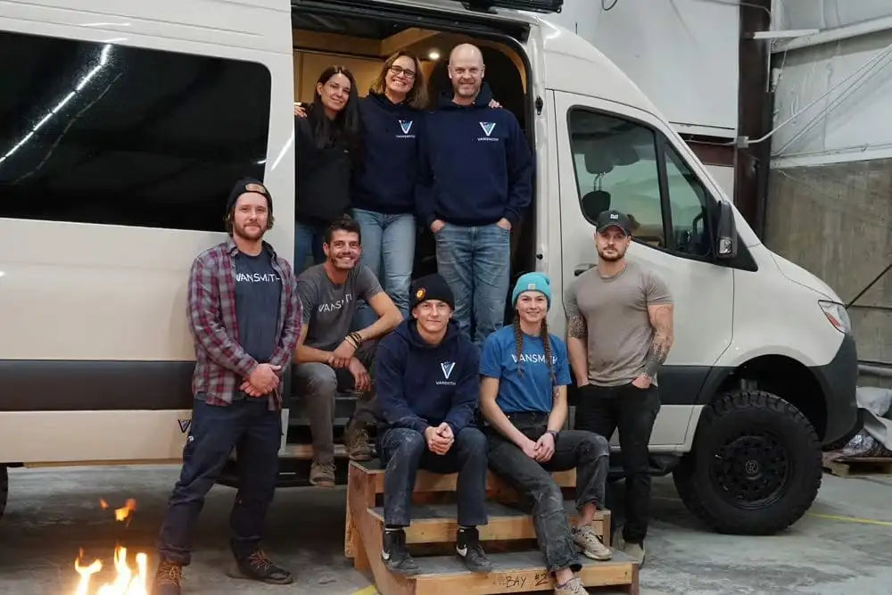 The Staff of The Vansmith Outside One of Their Custom Sprinter Camper Van Conversions in Boulder, Colorado