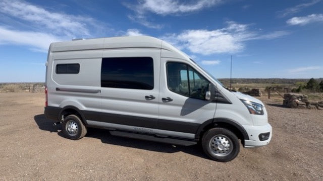 2025 Ford Transit High-Roof side view with mountains