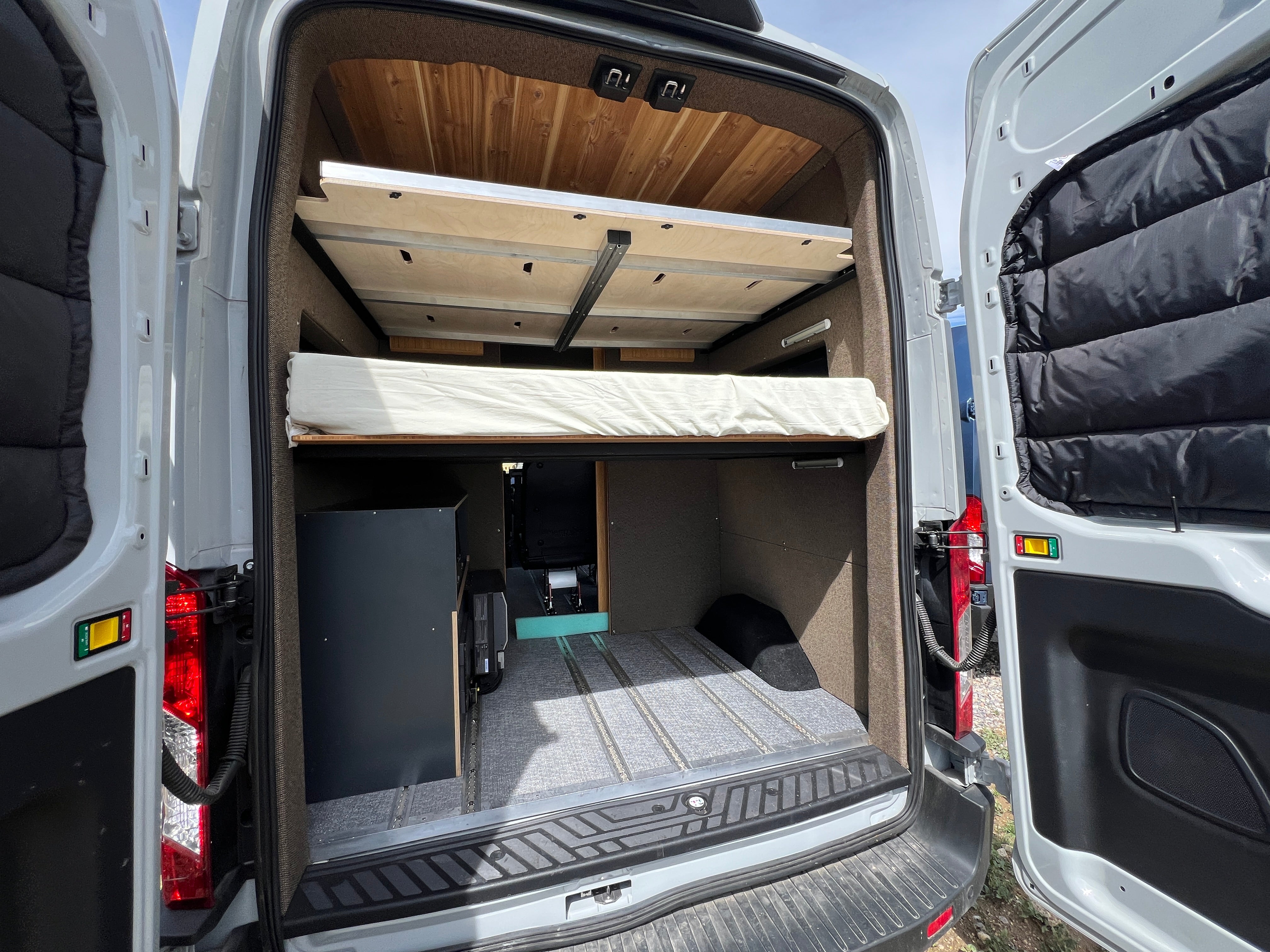 Floating bamboo bed platform with rear doors open
