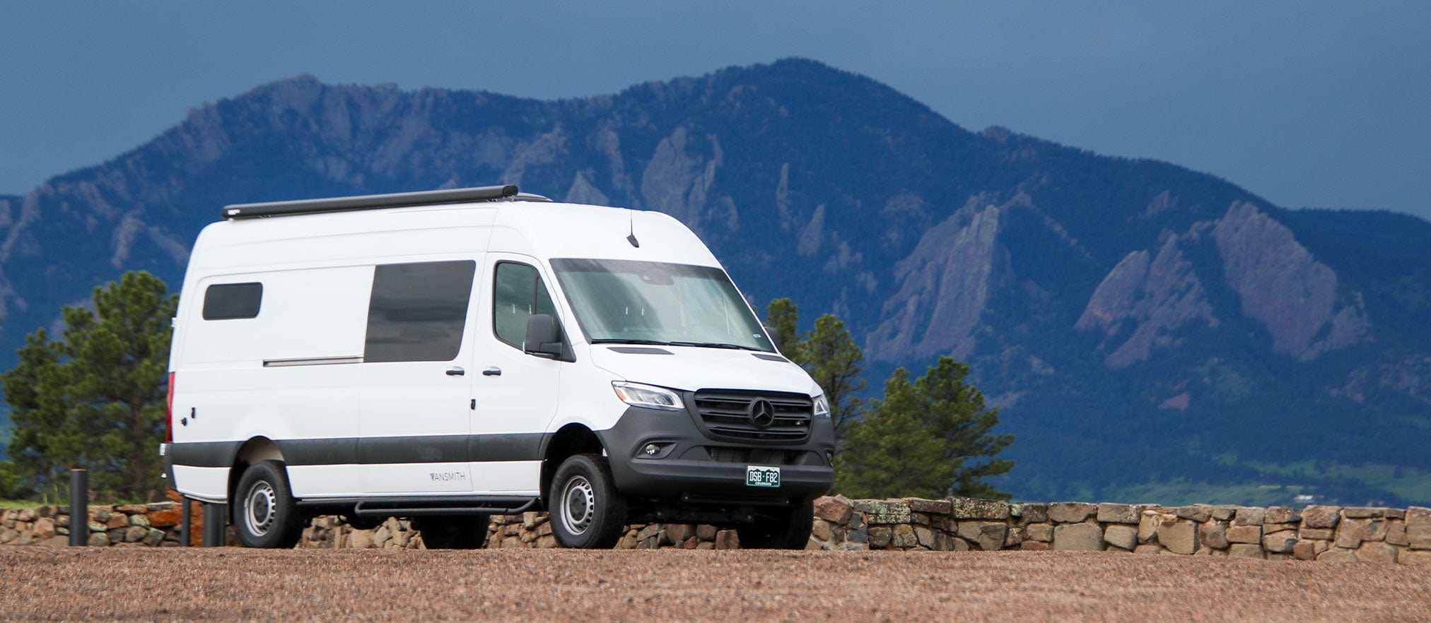 Woman Dressed Cozily in Heated Camper Van, Sprinter Van Heater Installed, and Exterior of Sprinter Van Driving Through Snow in Colorado