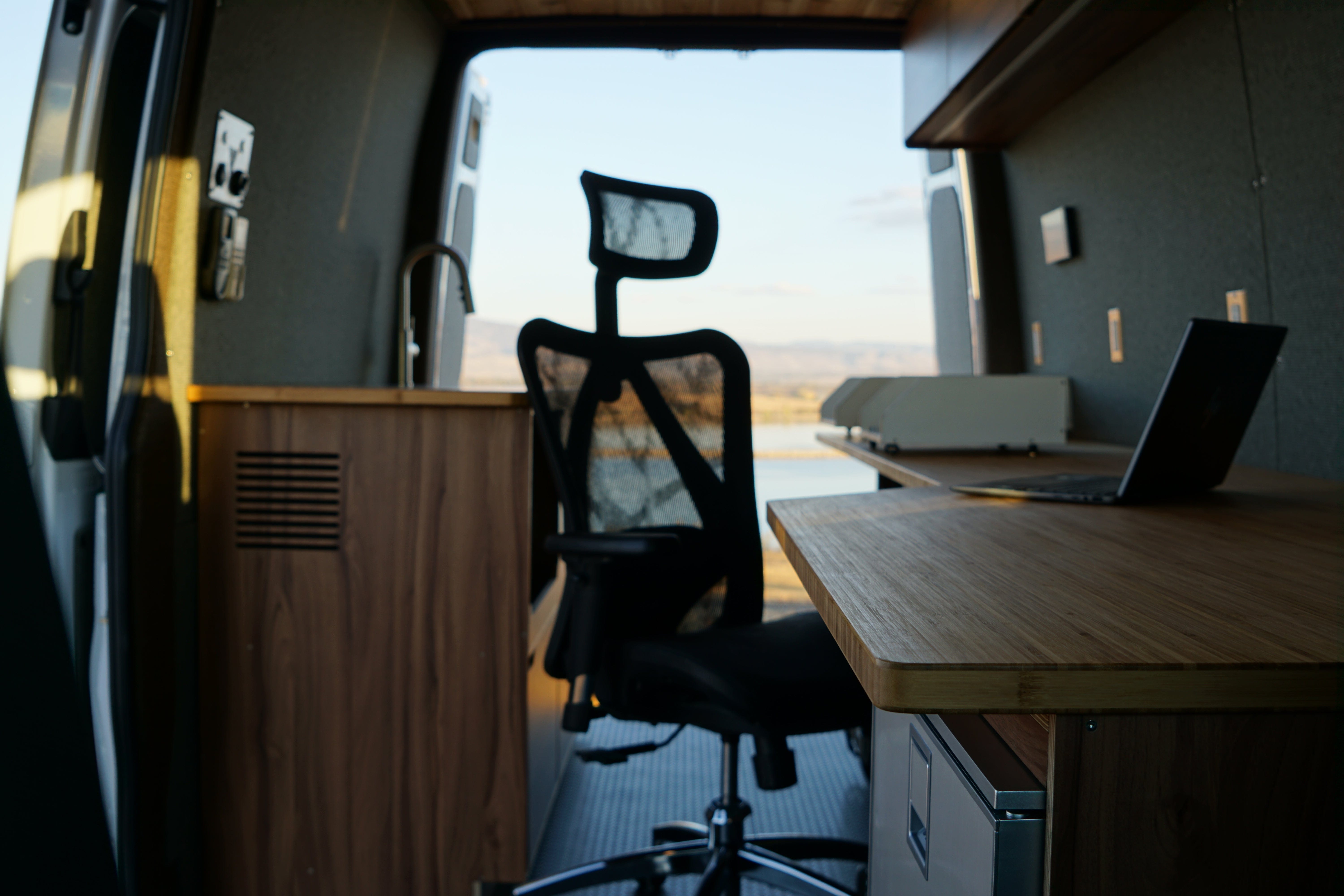 Woman Dressed Cozily in Heated Camper Van, Sprinter Van Heater Installed, and Exterior of Sprinter Van Driving Through Snow in Colorado