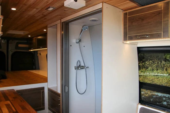 Enclosed Shower with Detachable Showerhead in The Vansmith Sprinter Van for Family of 3, 4 or 5