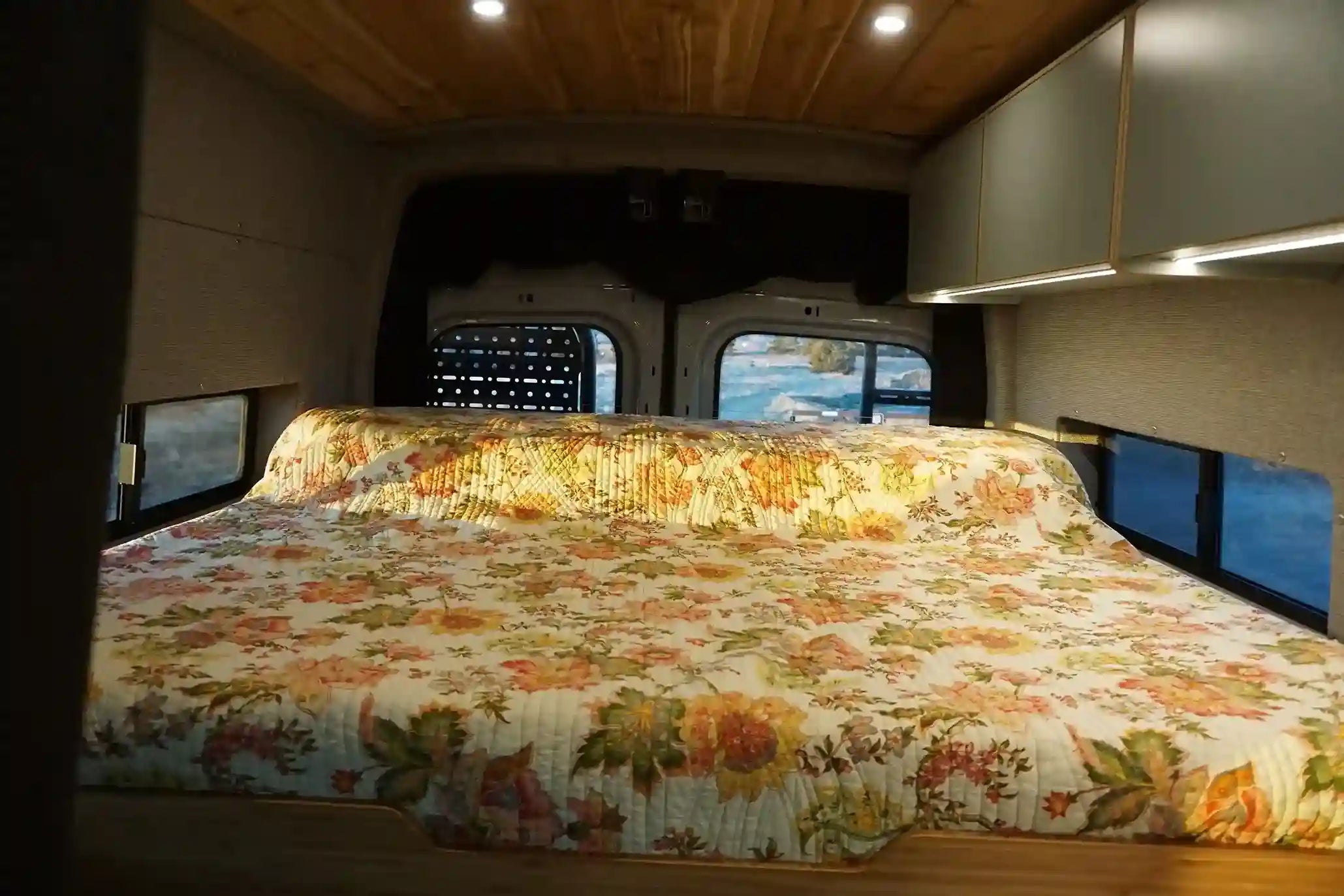 Custom van interior with sliding bed partially extended