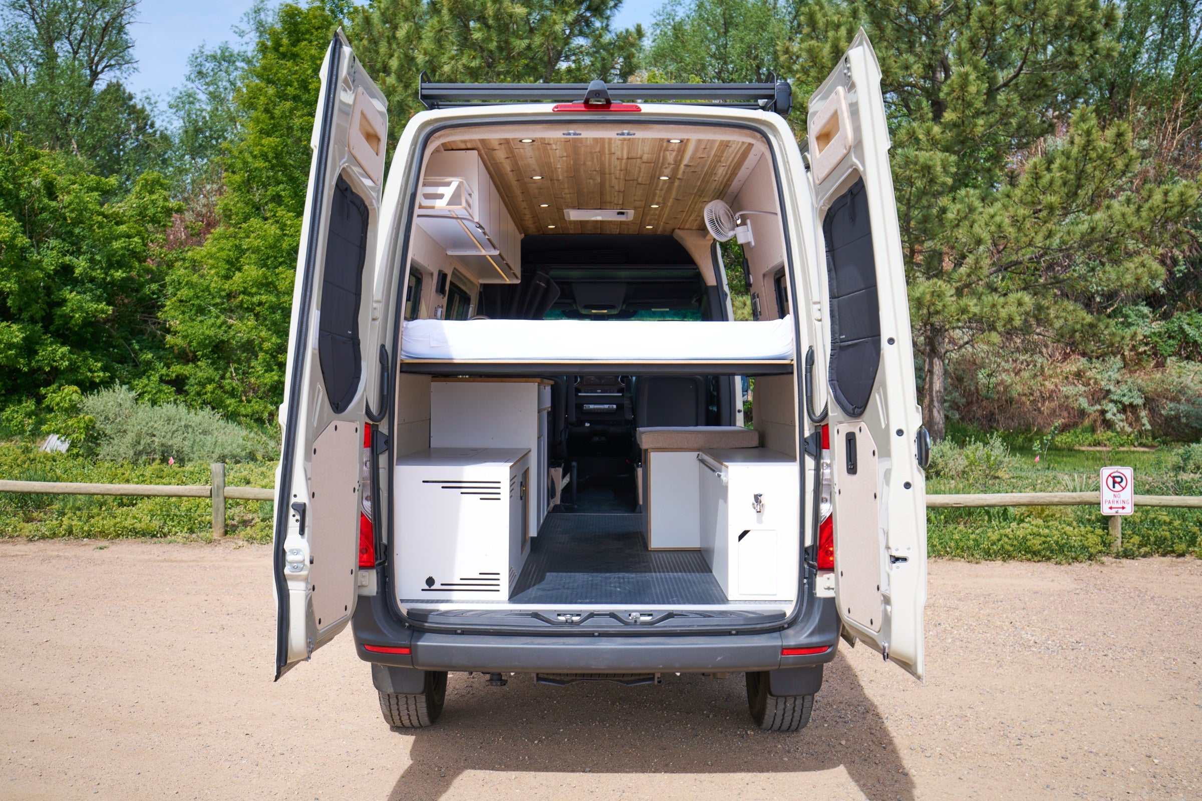 Rear view of Sprinter Bivy Classic camper van with both back doors open showing interior - The Vansmith