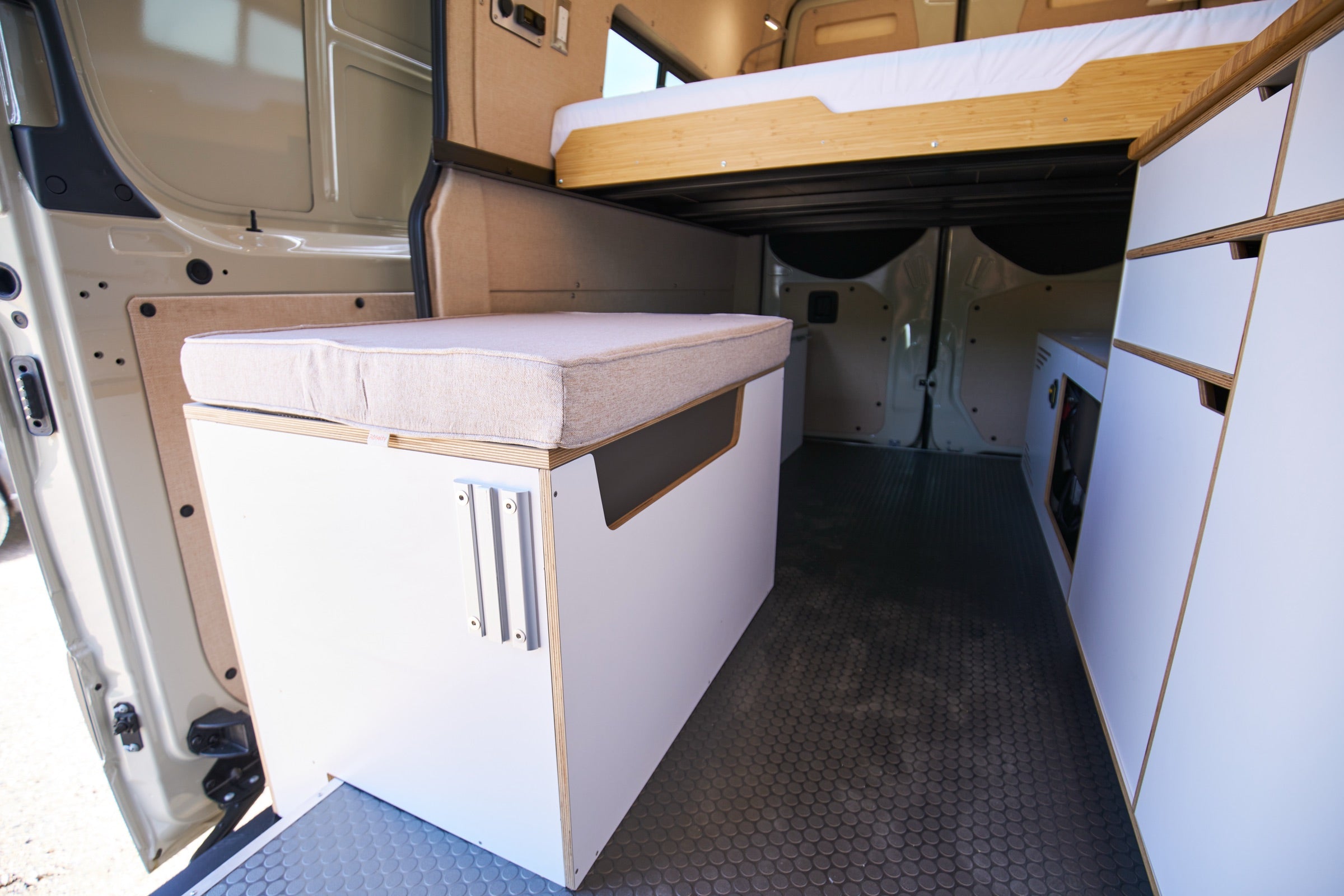 Rear cargo area and bench seat inside Sprinter Bivy Classic camper van - The Vansmith