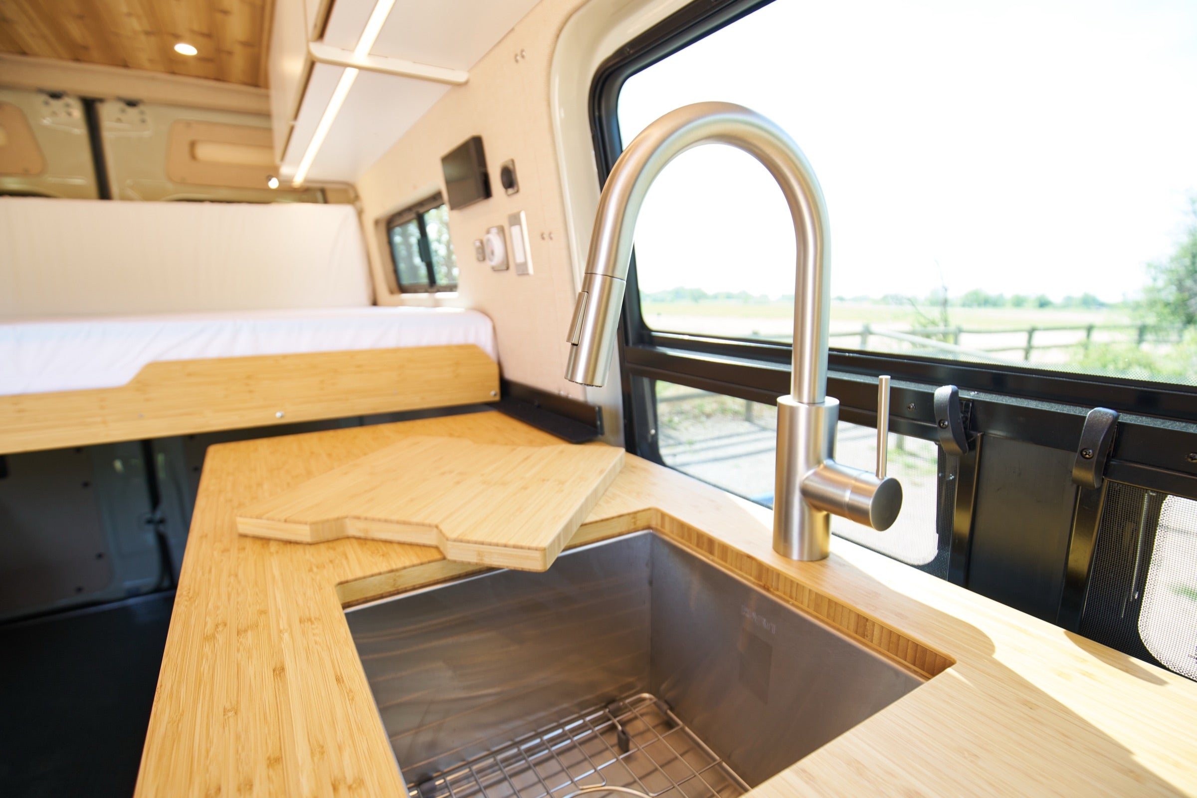 Kitchen sink and faucet inside Sprinter Bivy Classic camper van - The Vansmith