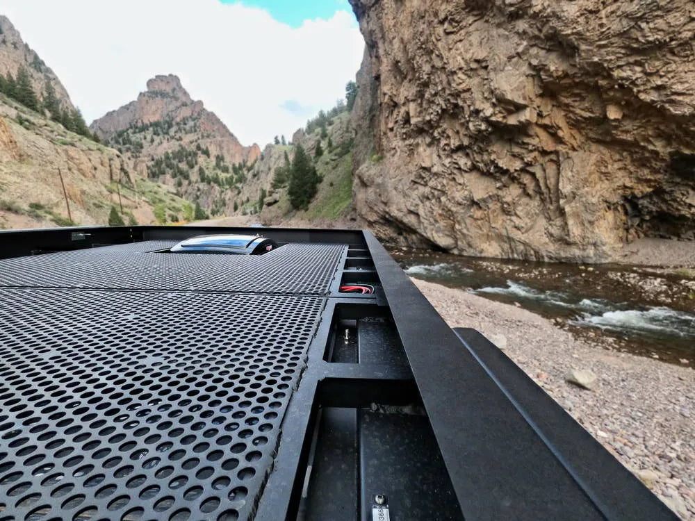 Roof rack with solar panel on Bamboo Sprinter van at Colorado canyon overlook