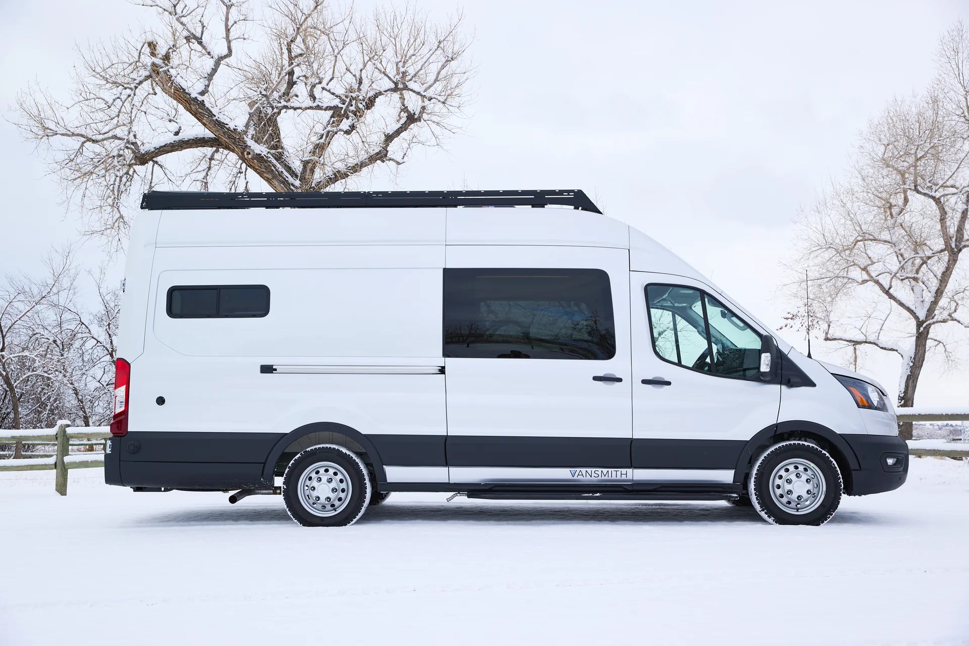 Cowboy Ford Transit van conversion with bamboo ceiling and elevated bed by The Vansmith