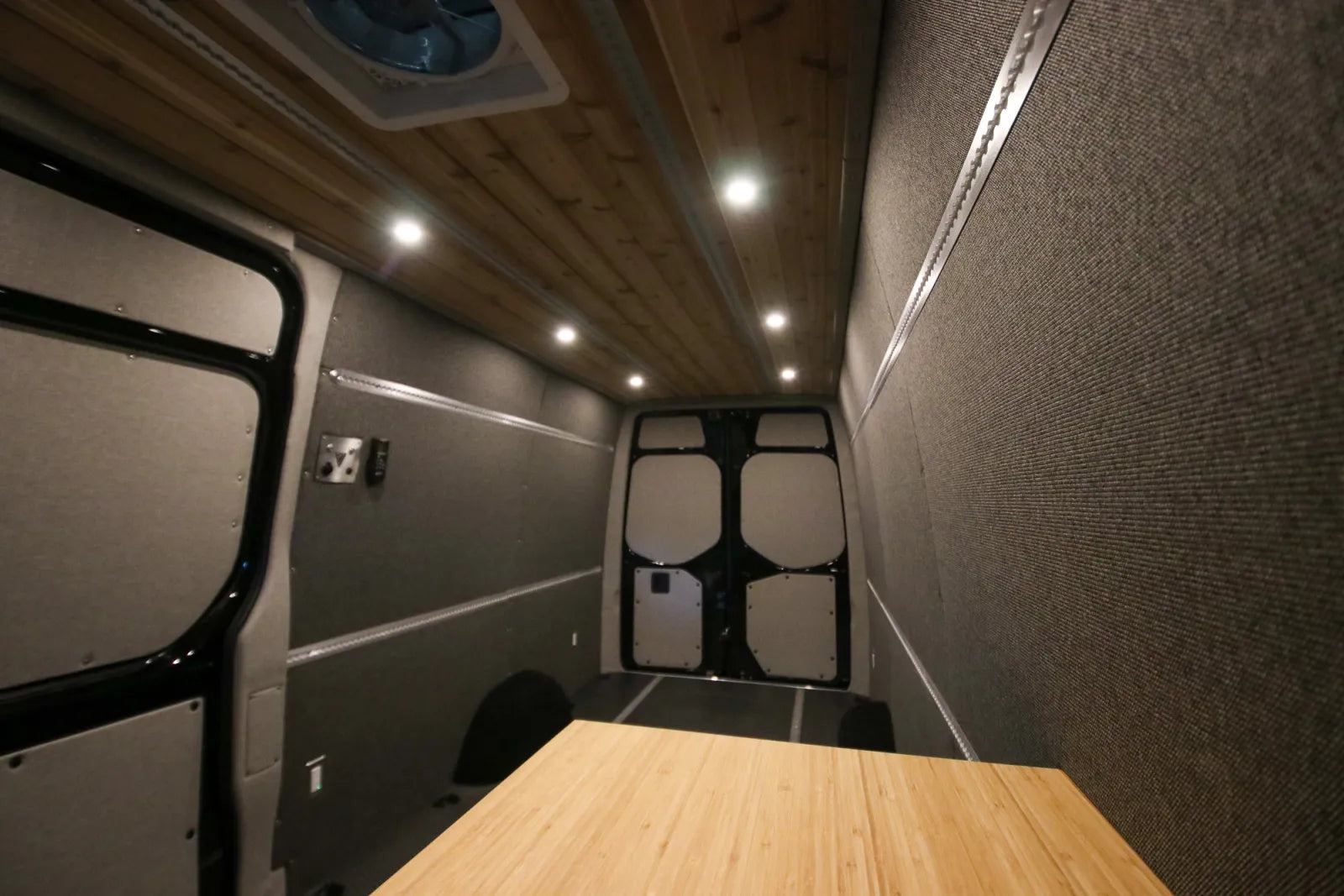 Foundation Sprinter van interior with cedar ceiling, insulated walls, and bamboo cabinetry by The Vansmith