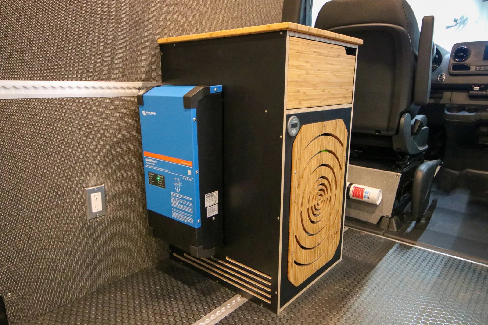 Victron inverter and bamboo electrical cabinet inside Foundation Sprinter van conversion