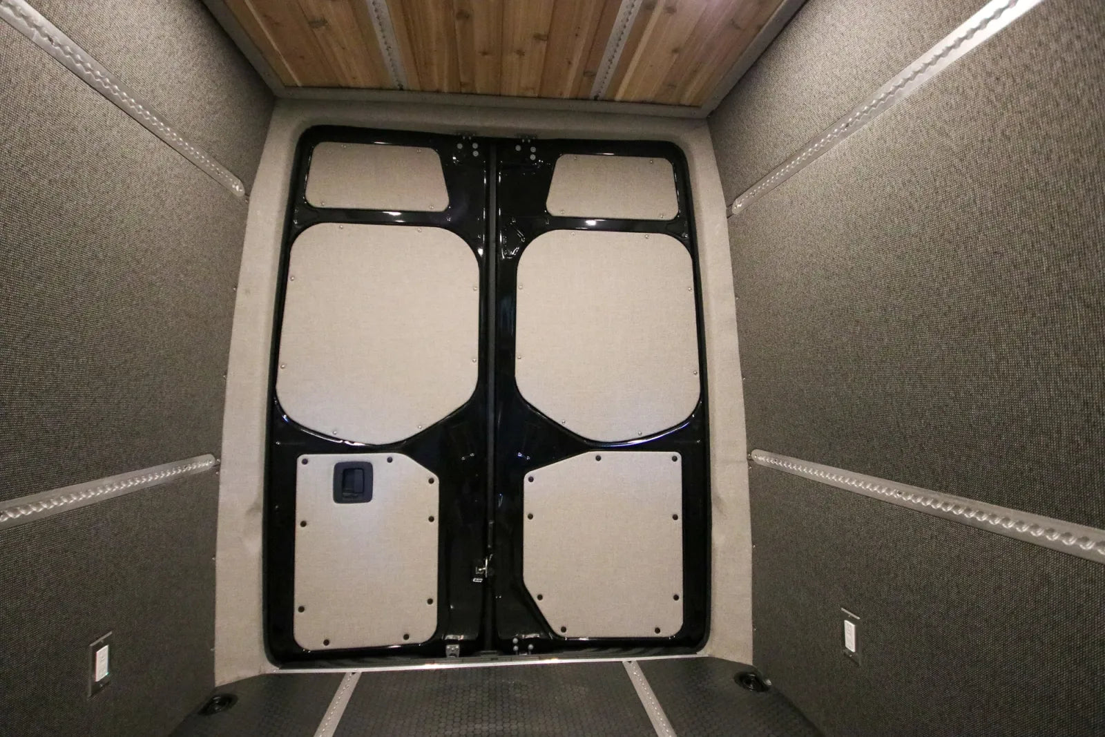 Insulated rear doors with window covers in Foundation Sprinter van conversion