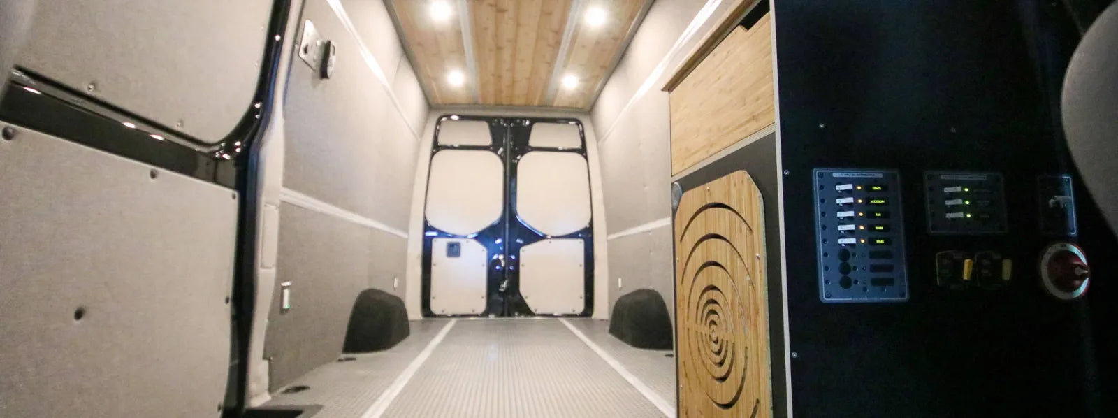 Foundation Sprinter 170 interior showing insulated walls, electrical panel, and cedar ceiling by The Vansmith