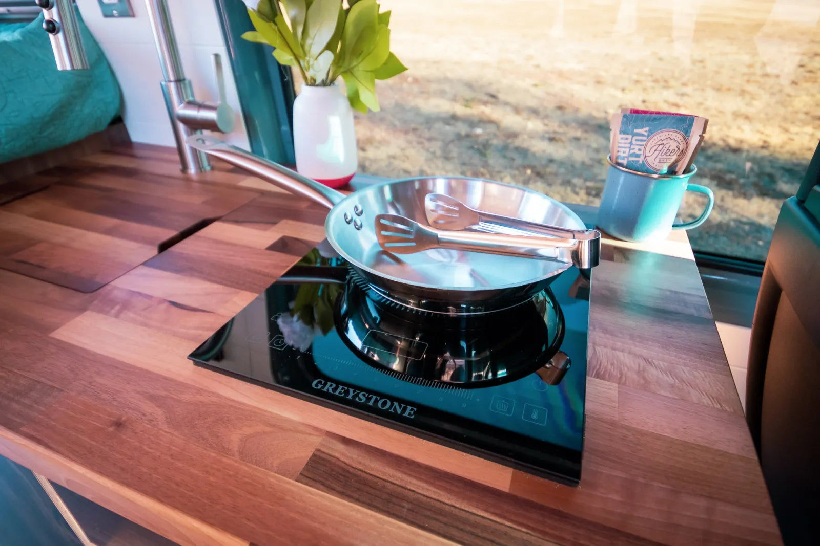 Jimmy van conversion Greystone induction cooktop on walnut butcher block countertop by The Vansmith