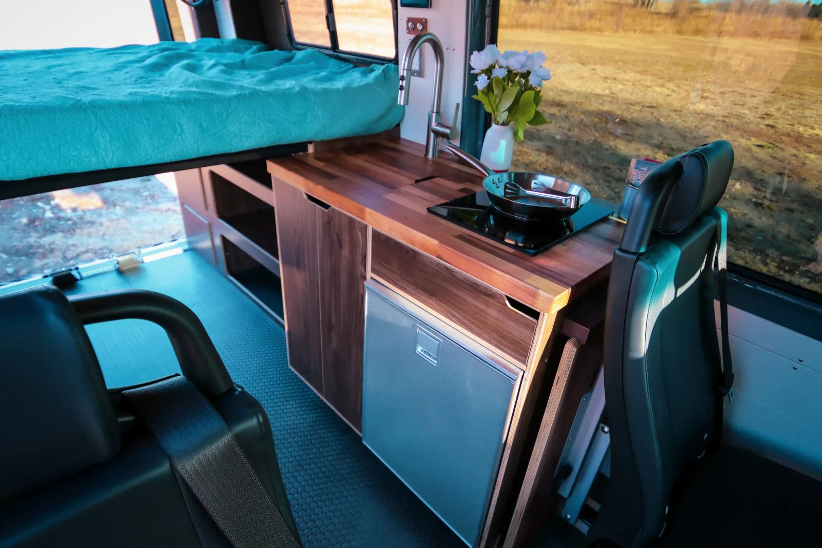 Jimmy Sprinter van walnut kitchen galley with sink fridge and butcher block countertop by The Vansmith