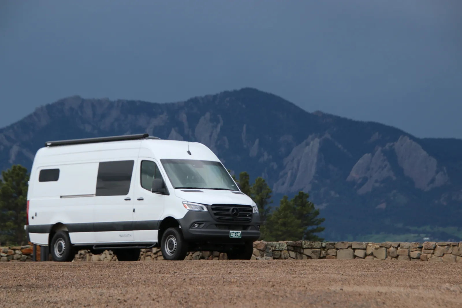 Maverick Sprinter 170 van exterior with roof rack and Boulder Flatirons backdrop by The Vansmith