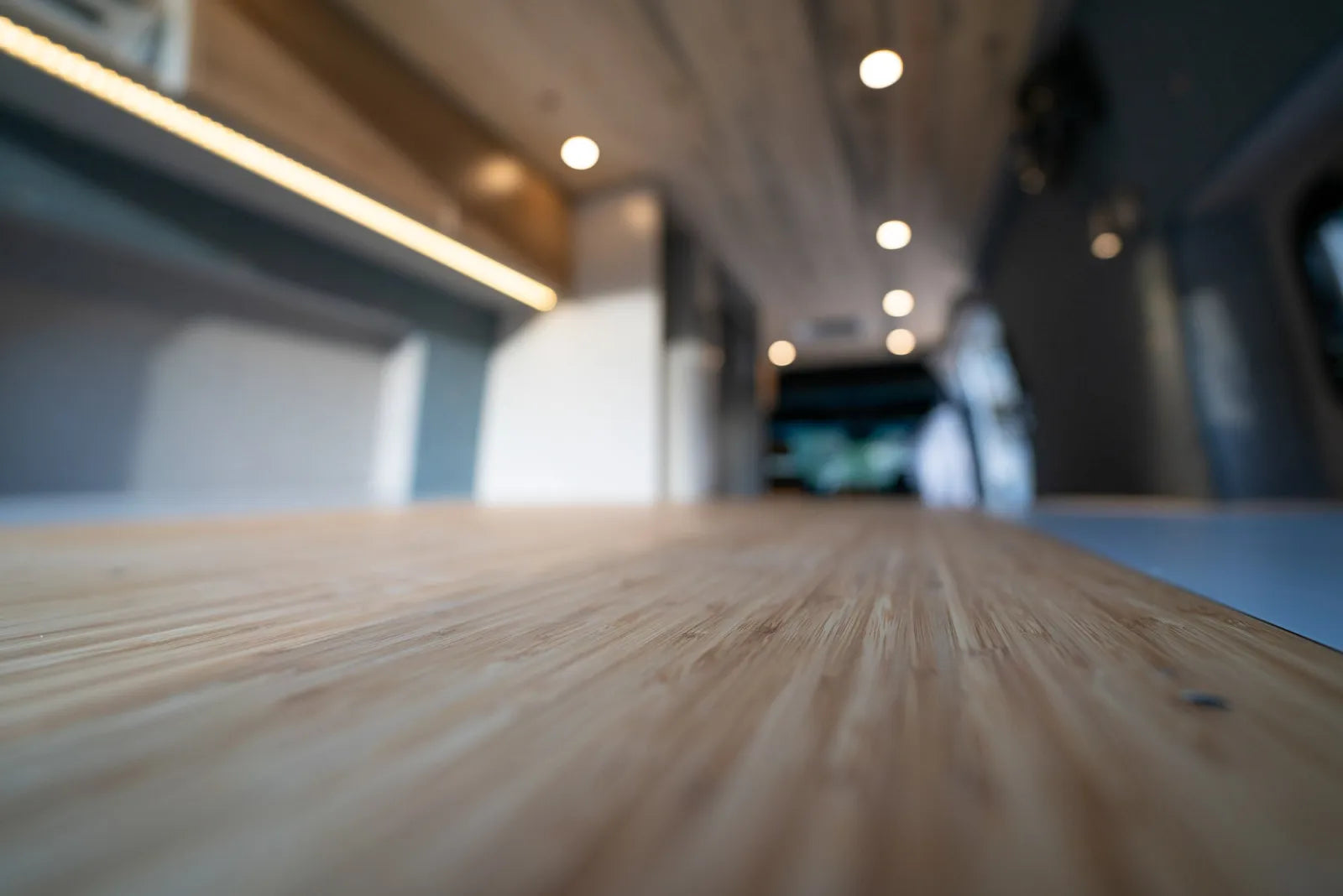 Bamboo countertop close-up with LED lighting in Outpost Sprinter van conversion