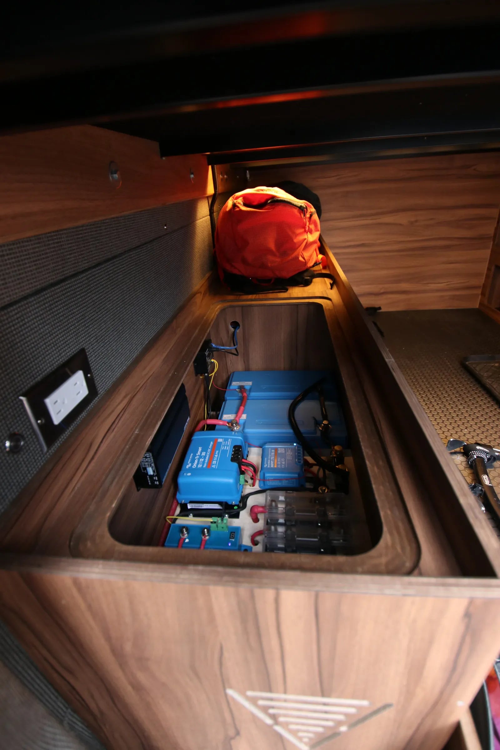 Rapp van electrical system with Victron batteries and inverter under bench